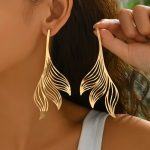 Feather statement drops earring